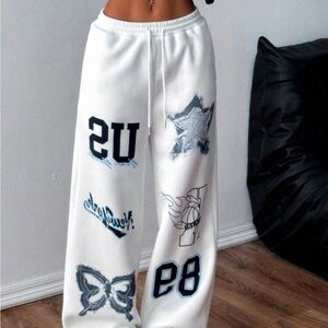 White Graphic Sweatpants with Black and Blue Designs